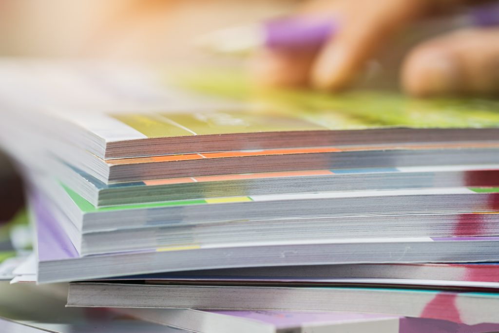 Businessman hands checking documents file paperwork financial ma Businessman hands checking documents file paperwork financial market, searching information on work busy desk office. Piles of document achieves with pen for sigh. Business report concept